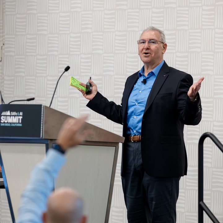 Alex Kanaan speaking at the 2026 SAFe & AI Summit in San Diego